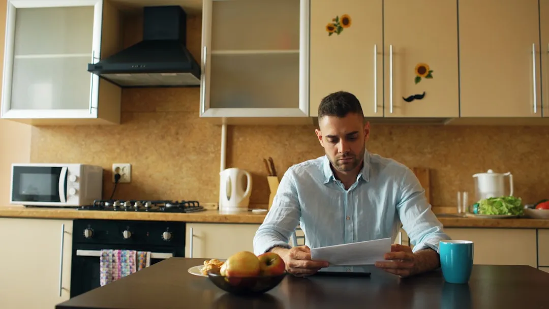 Homeowner reviewing energy bills and rebate documents - california energy rebates for ac upgrades